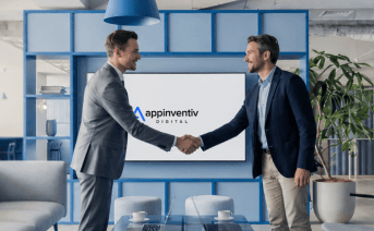 Two business partners shaking hands