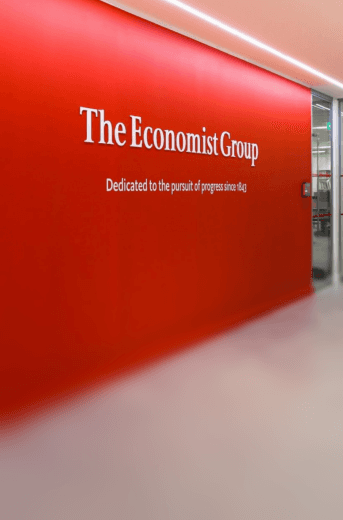The Economist Group office — red wall with brand signage