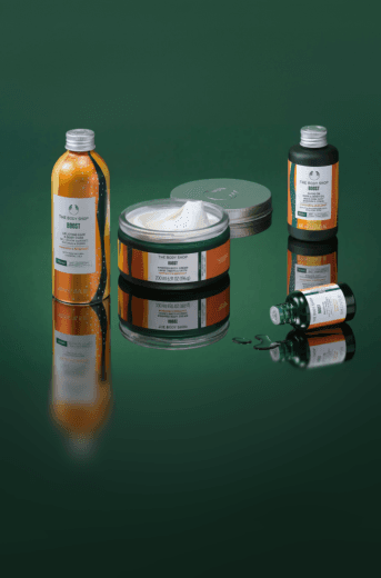 The Body Shop Boost product range on green backdrop